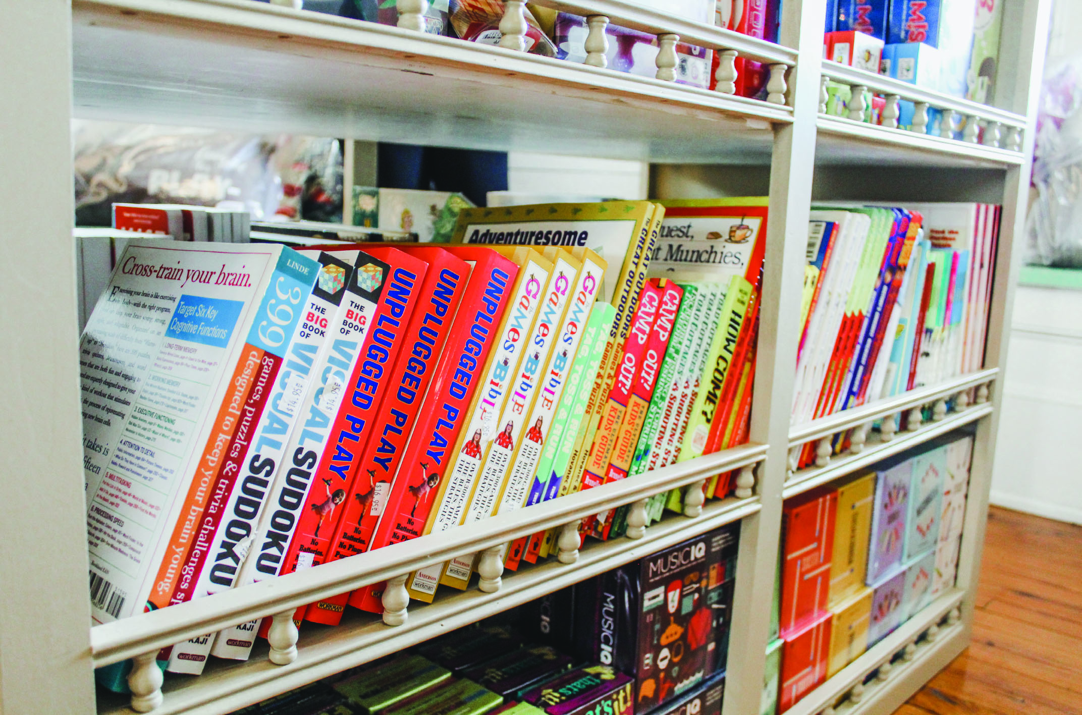 A shelf displaying a selection of various books.