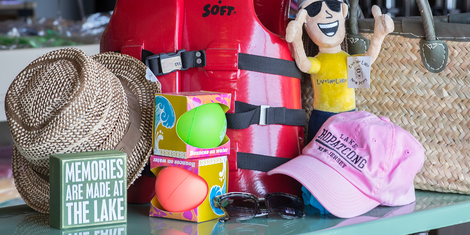Various items including a life jacket, toys, and hat