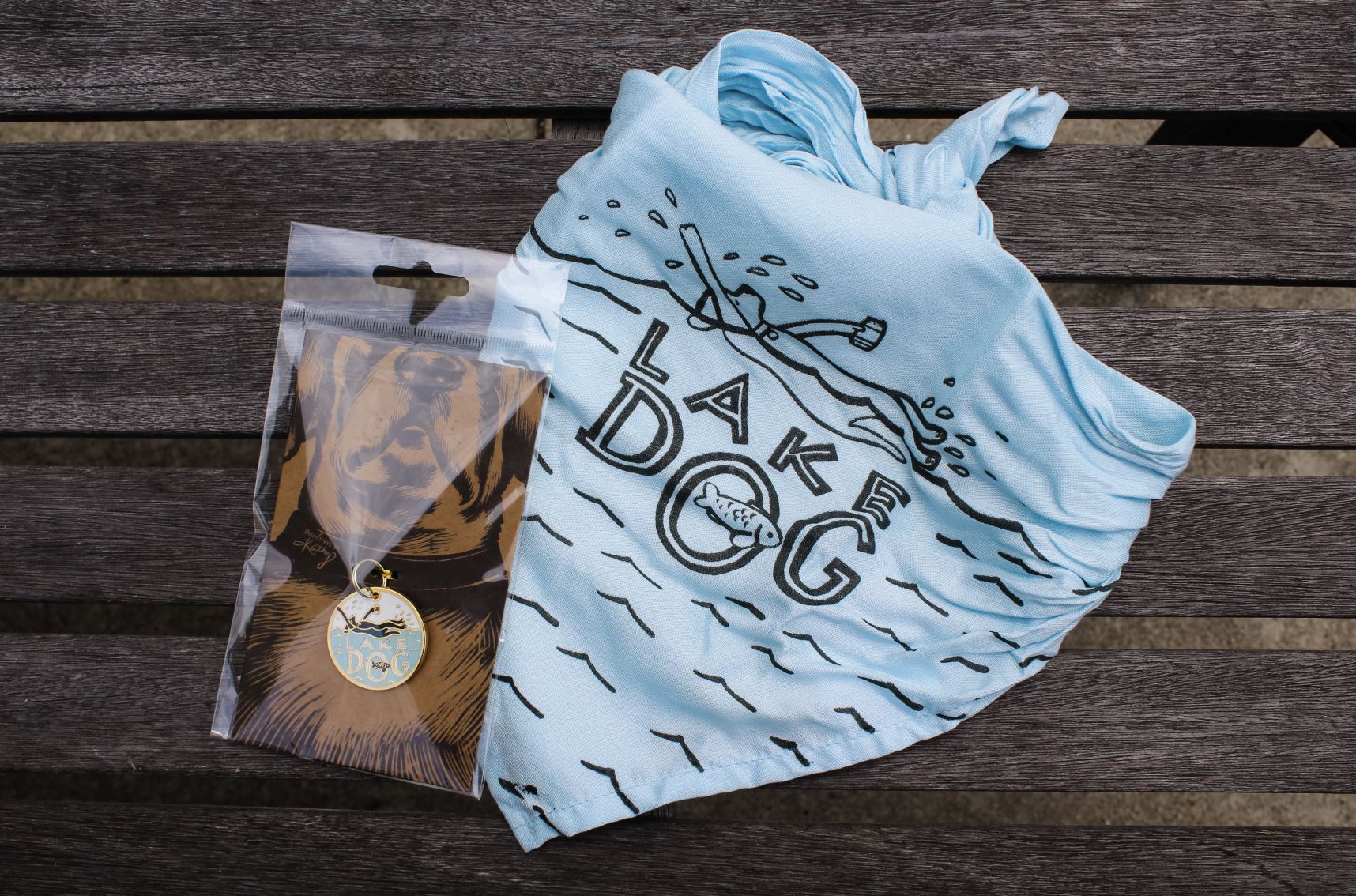 A dog bandana and key chain for a dog collar.