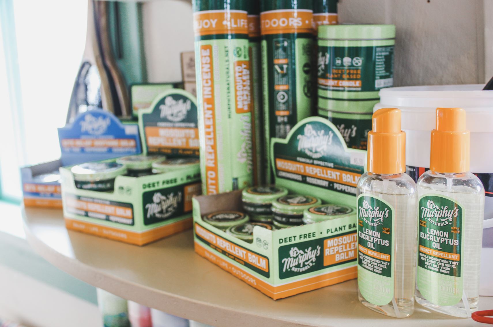 A shelf displaying a variety of bug repellents by Murphy's.